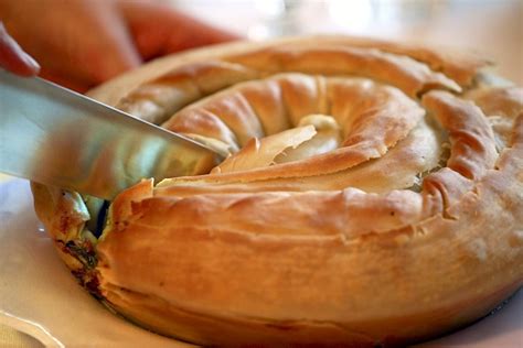 Phyllo dough cups are filled with apples drowned in caramel. phyllo dough breakfast pastries