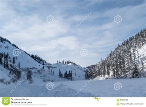 Winter Landscape In The Mountains With Blue Sky And Snow Capped Peaks