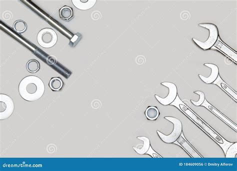 Wrenches Bolt Nut And Washers On A Gray Concrete Background Top View