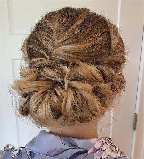 This textured updo uses a combination of braids and loosely pinned tousled locks for one of the most unique low updos we've ever seen. 60 Trendiest Updos for Medium Length Hair | Medium length ...
