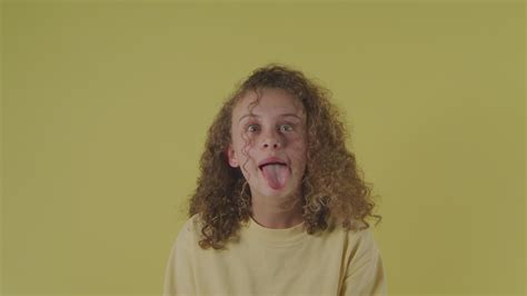 Teenage Girl Sticking Out Her Tongue Filmpac