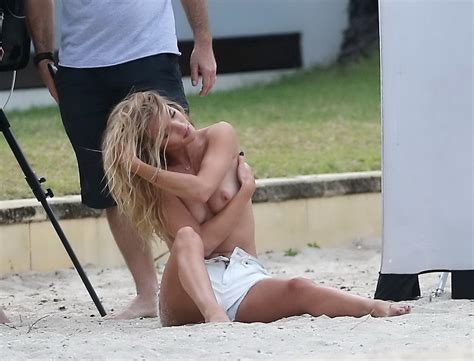 Rosie Huntington Whiteley Topless In A White Denim Shorts Doing A Beach