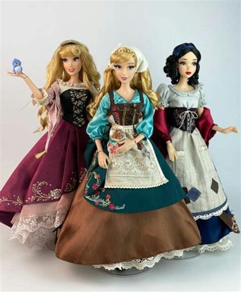 Three Dolls Are Standing Next To Each Other