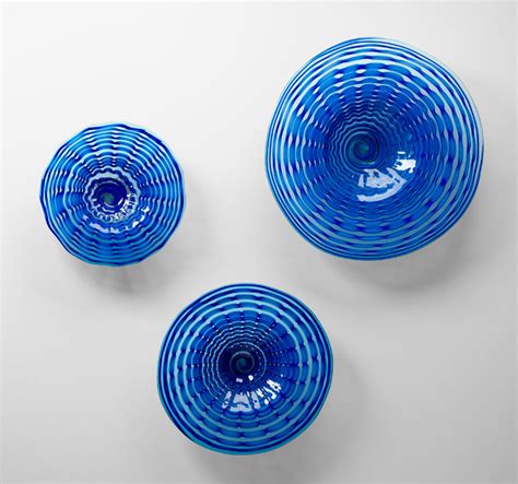 The key is to make the bowls the focal point in the. Small Aurora Blue Art Glass Plate by Cyan Design