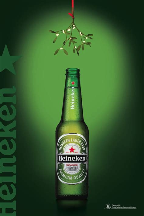 an advertisement for heineken beer on a green background