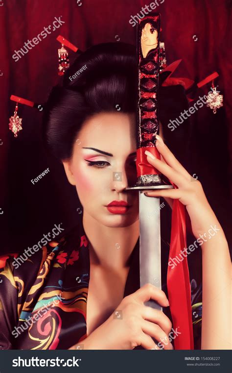 Beautiful Geisha In Kimono With Samurai Sword Stock Photo 154008227