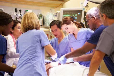 Medical Team Working On Patient In Emergency Room Stock Photo Image