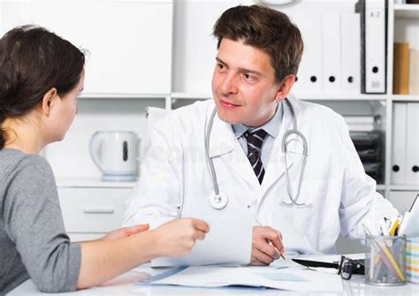 doctor speaking with client in the medical center stock image image of healthcare sitting