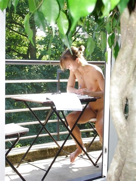 Working Naked On The Balcony Nudeshots