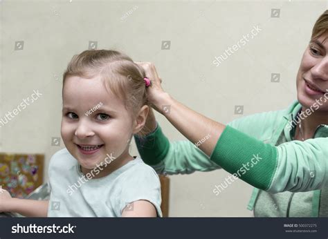Mother Arranging Hair Her Happy Daughter Stock Photo 500372275