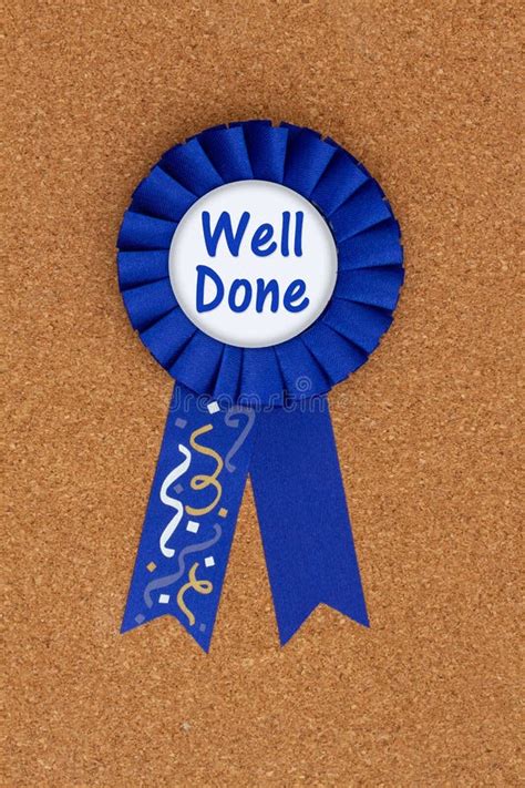 Well Done Message On Blue Winner Ribbon On A Bulletin Board Stock Photo