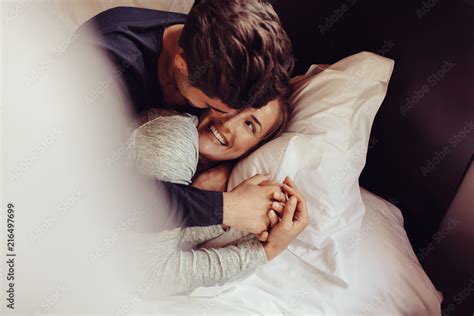 Romantic Couple In Love Lying On Bed Stock Photo Adobe Stock
