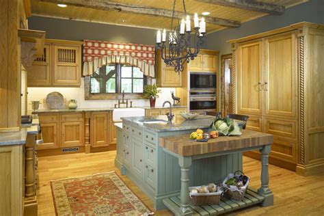 Made from pine wood frame, it's finished in a solid hue with antiqued details, and showcases two glass cabinet doors fronted by a cutout motif for visual interest. Six degrees of separation from a white kitchen! | TREND