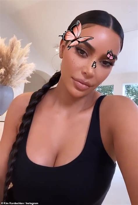 Kim Kardashian Showcases Her Ample Cleavage In Low Cut Tank Top While