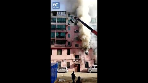 man rescues 14 people from burning building with crane youtube