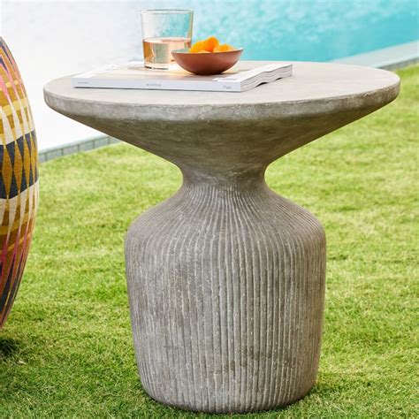 A thick, layered composite of stone and cement is hand finished by artisans who mold each tabletop, revealing the textural variations why you'll love it hefty and handsome, our tambor concrete drum coffee table adds industrial style to your outdoor space. Tambor Concrete Outdoor Drum Side Table | West Elm