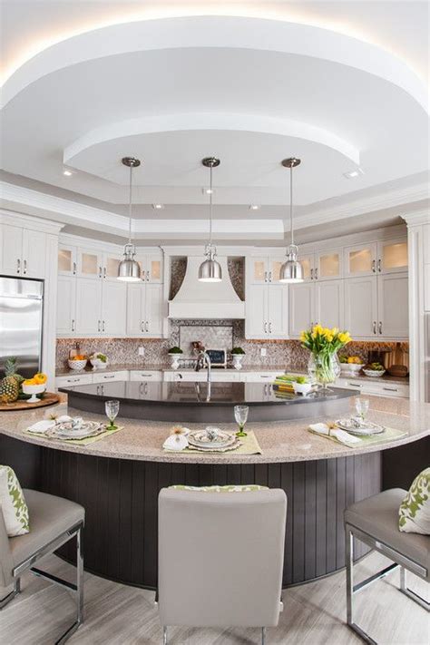 Gently curved kitchen cabinetry softens the sharp lines and hard surfaces found in kitchens, can help make small kitchens feel more spacious, and will get the balance right between contemporary and rustic styles by choosing a freestanding kitchen island idea that combines traditional craftsmanship. A Guide to 6 Kitchen Island Styles | Curved kitchen island ...