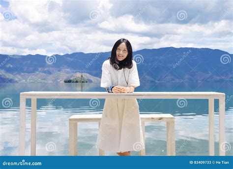 Girl Looks At Camera Standing Behind High Table Stock Image Image Of