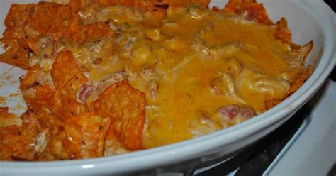 In a large bowl, mix together the chicken, rotel, cream cheese, sour cream, taco seasoning and. Chicken Dorito Casserole