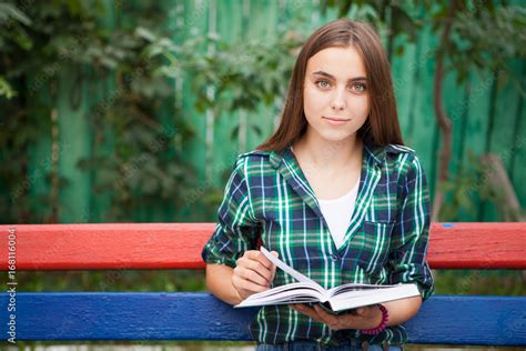Beautiful Student Girl Reading Book Outdoors Stock Photo Adobe Stock