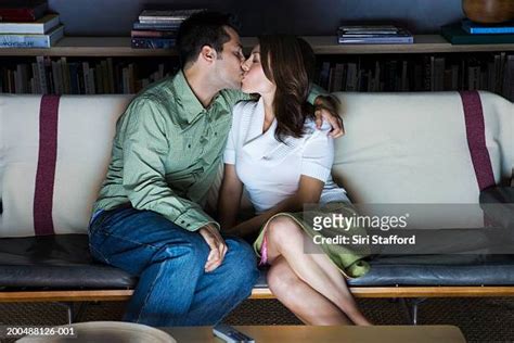 couple making out couch photos and premium high res pictures getty images