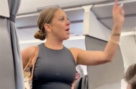 woman has meltdown on plane video claims person is “not real”