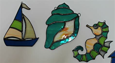 Stained glass *includes real air plant* holder. I crafted a set of five stained glass beach themed sun ...