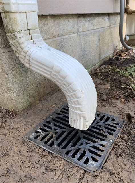 Gutter Downspout Draining Water Into A Catch Basin Drainage Solution For Diverting Roof