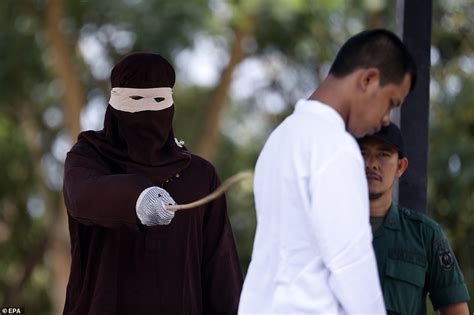 indonesian woman is caned in public for having sex outside marriage photos naija gbedu