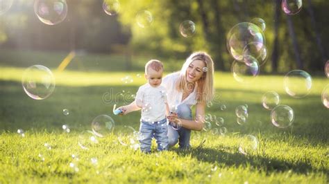 Mom And Baby Blow Bubbles In The Park Stock Image Image Of Spring