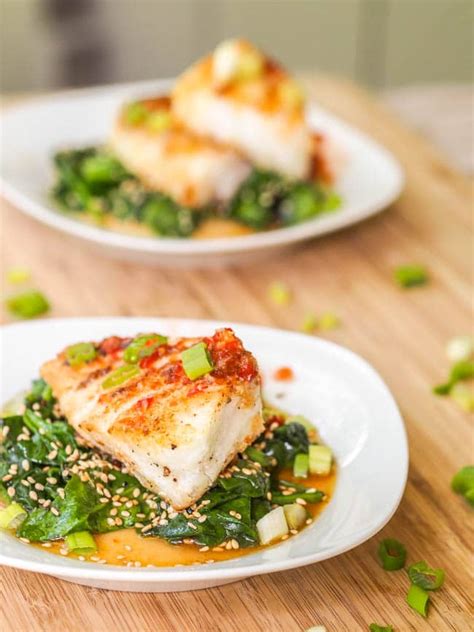 Baking this delicious chilean sea bass in foil along with garlic cream spinach served topped with a lemon parmesan cream sauce makes for the perfect dinner idea anytime! Seared Chilean Sea Bass Recipe {Gluten-Free, Dairy-Free}