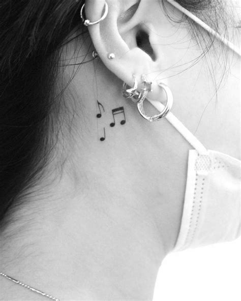 A Womans Ear With Musical Notes On It And A Treble Behind Her Ear