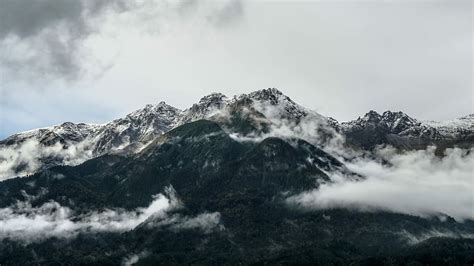 Hd Wallpaper Mountain Under White Cloudy Sky Smoke Covered Mountain