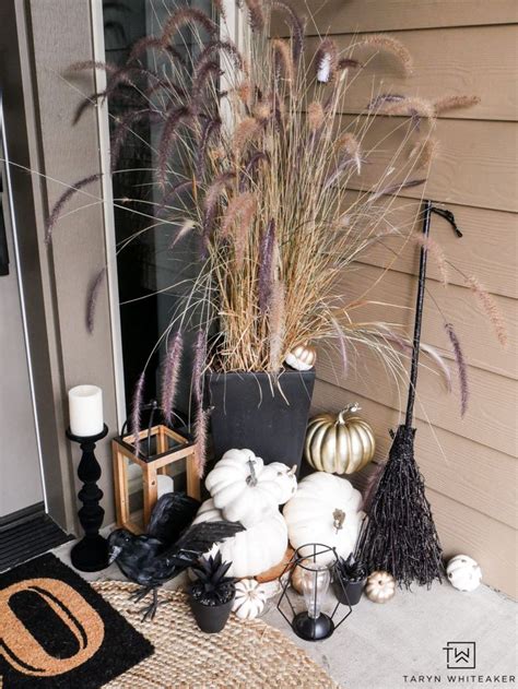 Easily Transition Your Fall Porch Into Halloween With Lots Of Black And White Pumpkins Creepy