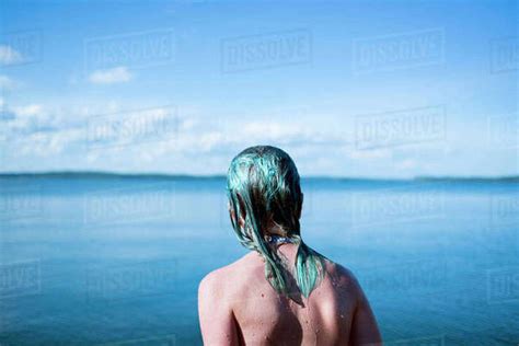 Rear View Of Girl By Lake Stock Photo Dissolve