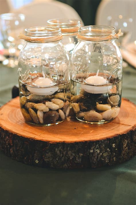 Mason Jar Centerpieces...I have the stones and we could buy the jars