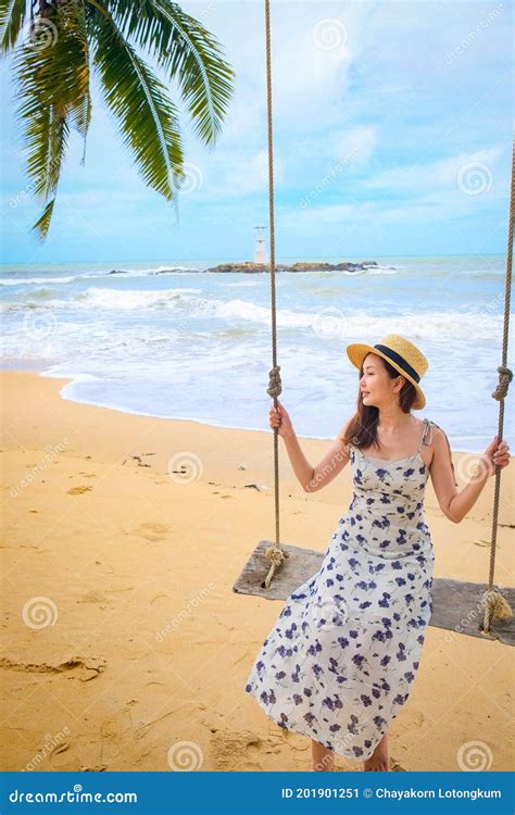 Pretty Girl On Swing With Backgound Of Nang Thong Beach In Khao Lak Lighthouse Stock Image