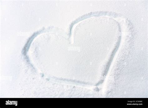 Heart Drawn On Fresh Snow Texture Symbol Of Heart On Snowy Surface