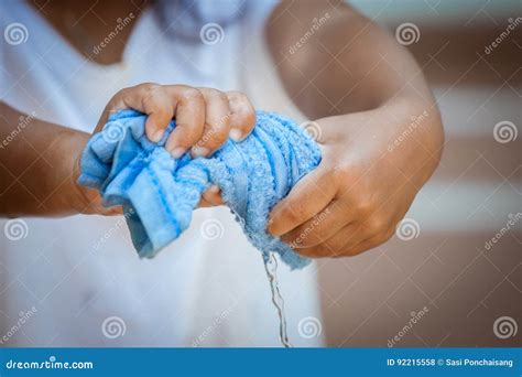 Child Hands Squeeze Wet Blue Towelp Stock Photo Image Of Hands Asian
