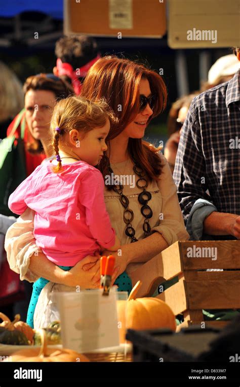 pregnant alyson hannigan and her daughter satanya denisof at a farmers market in brentwood
