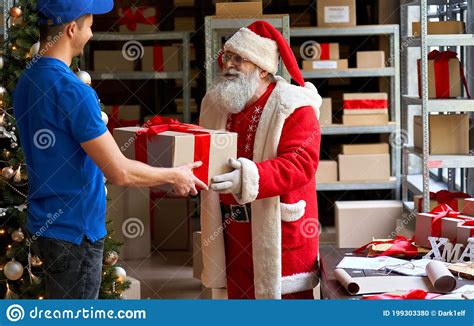 Happy Santa Claus Giving Parcel T Box To Courier Fast Christmas