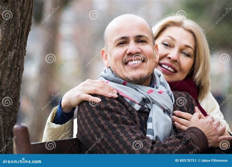Mature Woman And Elderly Man Posing Together Outdoors Stock Image