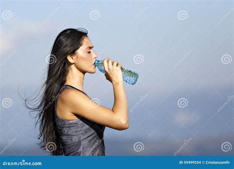 A Beautiful Sporty Caucasian Girl Drinking Water Stock Photo Image Of