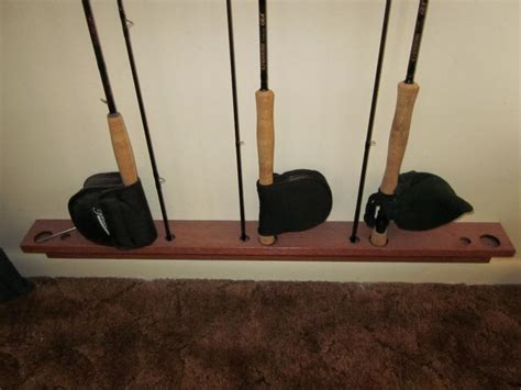 My rod storage system consisted of laying the rods horizontally on shelf brackets but it was clumsy and took up 7 linear feet of shelf space. DIY Ceiling Mounted Fishing Rod Holder — Florida Sportsman