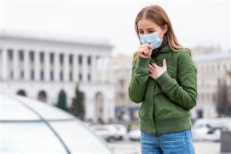 premium photo woman wearing surgical face mask in public spaces