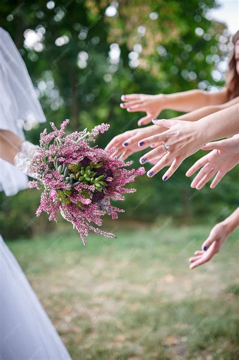 premium photo bride throwing bouquet for guests to catch