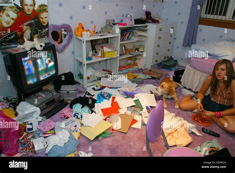 Girl Teenager In Very Messy Bedroom Stock Photo Alamy