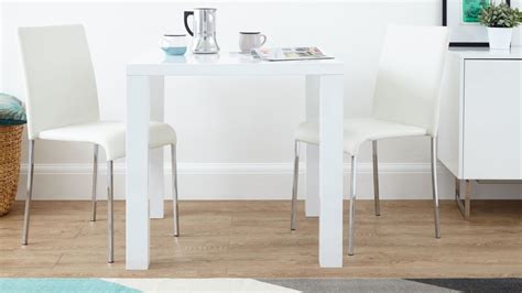 If you sit too high, your thighs might hit the underside of the tabletop, which can turn long dinners into a torment. Fern White Gloss Kitchen Table | Danetti
