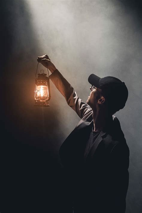 Hd Wallpaper Man Holding Lighted Gas Lantern Man Holding Up A Lantern