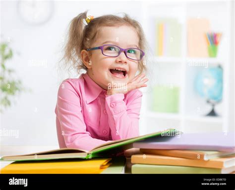 Happy Kid Reading Books And Dreaming Stock Photo Alamy